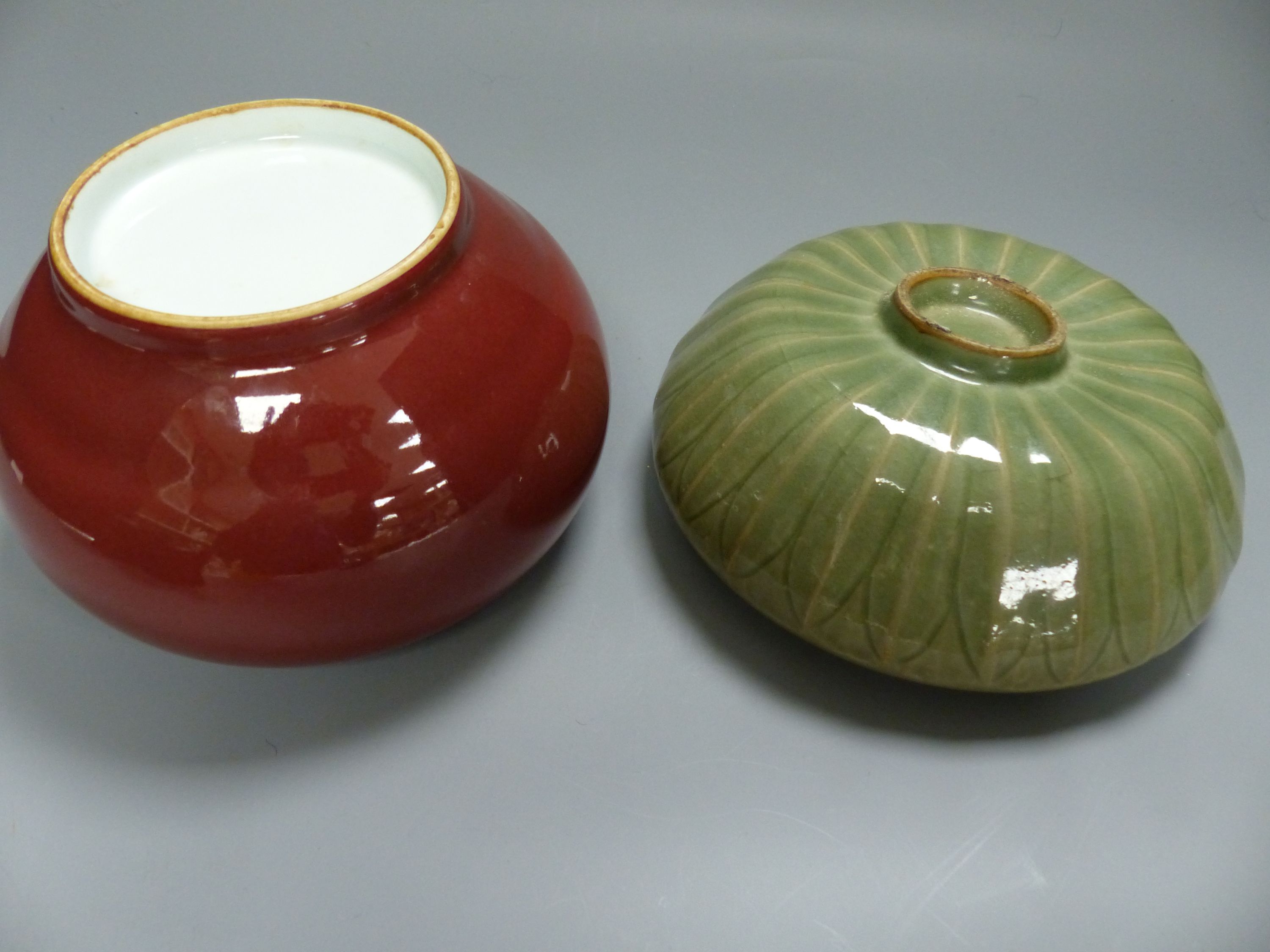 A Chinese Sang de Boeuf censer, a similar celadon glazed bowl, together with a Wedgwood black basalt teapot, c.1800 and a similar 20th